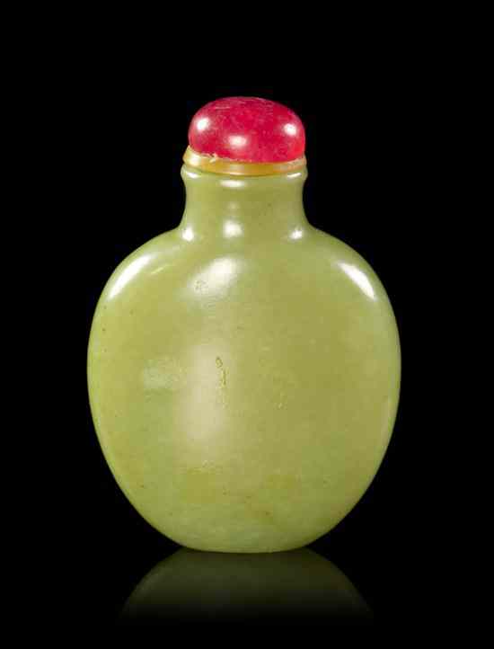 Appraisal: A Yellow Jade Snuff Bottle of compressed globular form and