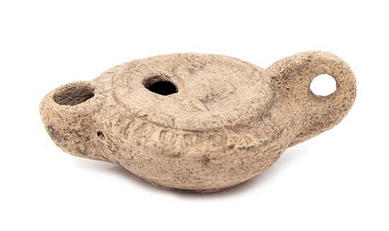 Appraisal: A Roman Terracotta Oil Lamp Length inches A Roman Terracotta