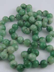 Appraisal: A green hard stone bead necklace each bead approx mm