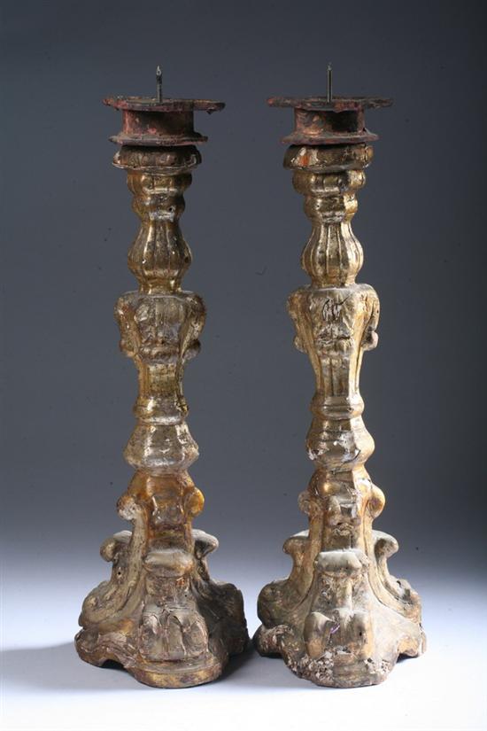 Appraisal: PAIR ITALIAN ROCOCO CARVED GILTWOOD PRICKET CANDLESTICKS th century Scrolling