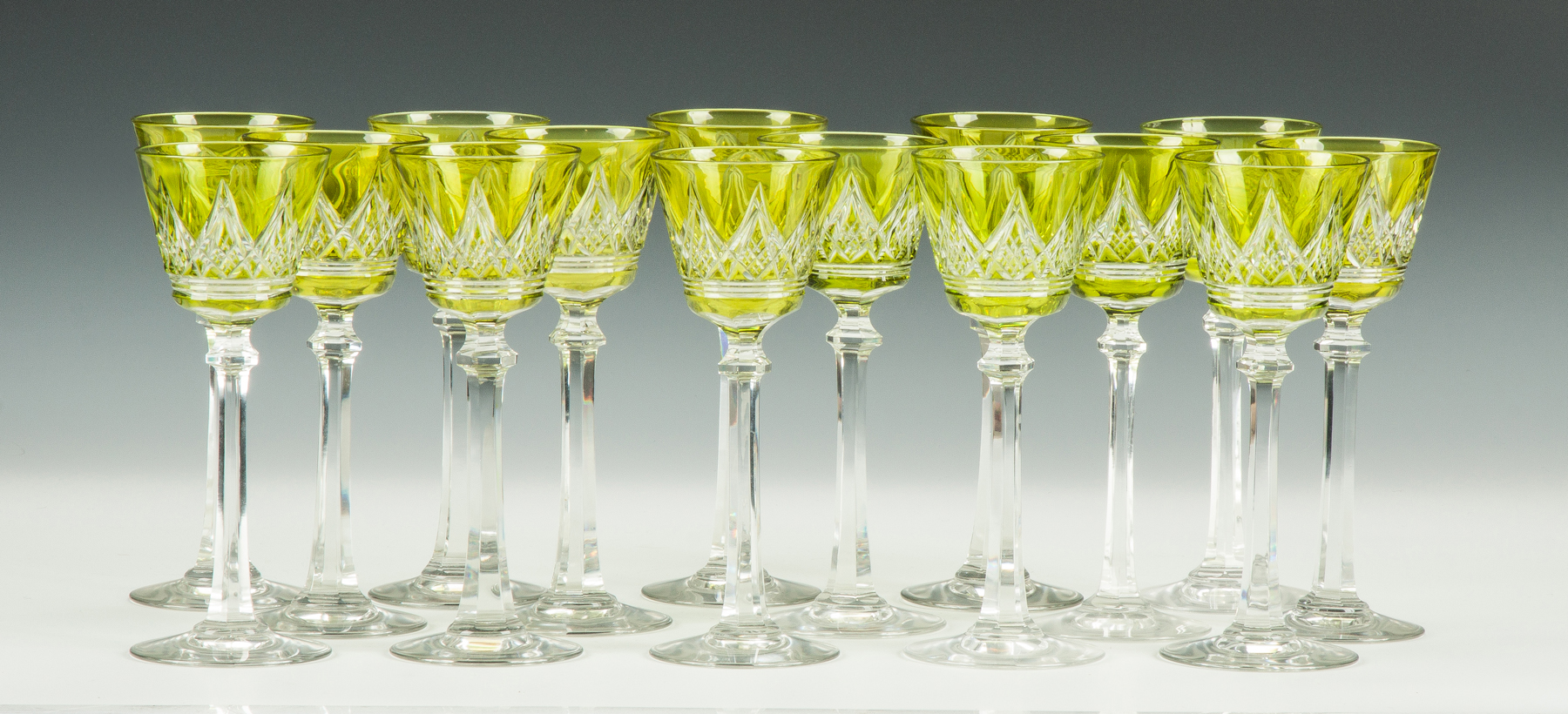 Appraisal: Fifteen Baccarat Green Overlay Cut to Clear Goblets Sgn