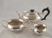 Appraisal: A silver three piece teaset the oval shape with embossed