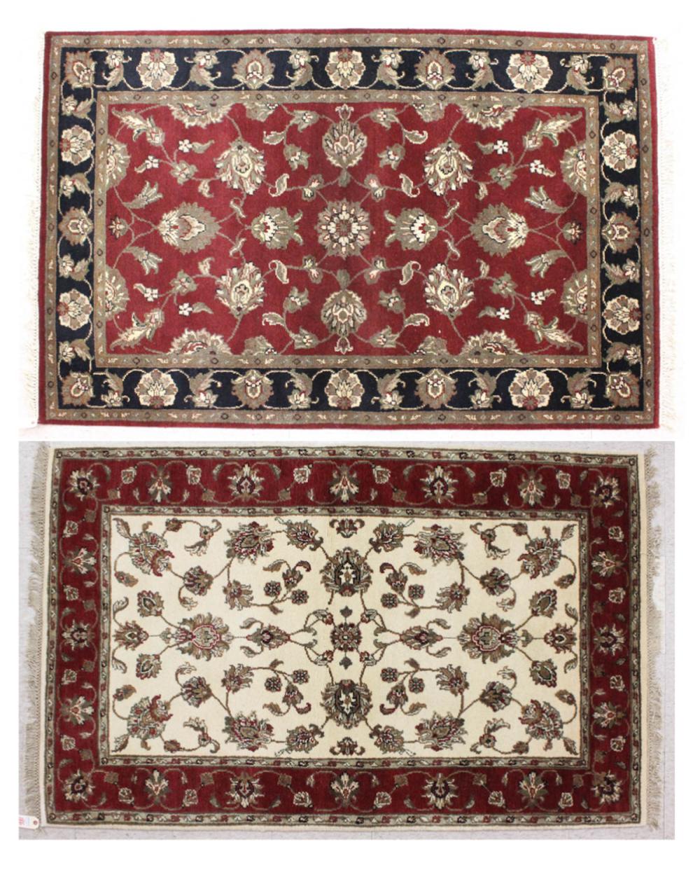 Appraisal: TWO HAND KNOTTED ORIENTAL AREA RUGS Indo-Persian similar floral designs