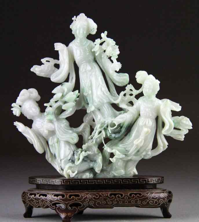 Appraisal: Chinese Qing Carved Jade Figural SculptureExquisitely carved of celedon jade