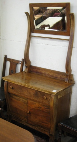 Appraisal: AN EMPIRE REVIVAL WALNUT WASHSTAND American c The front of