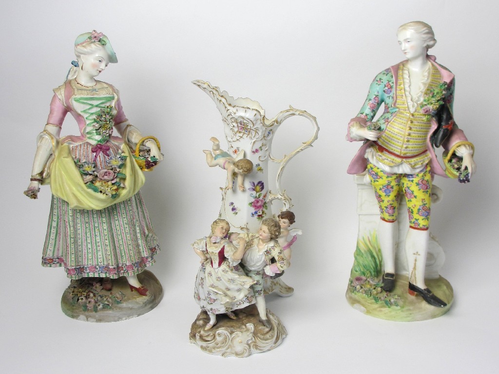 Appraisal: A pair of German porcelain figures of a lady and