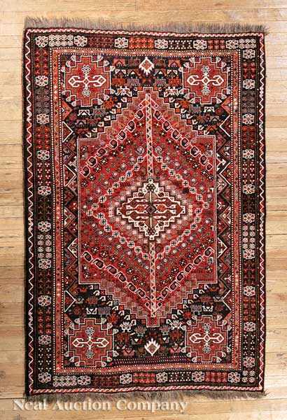 Appraisal: A Persian Serapi Carpet red and navy ground central geometric