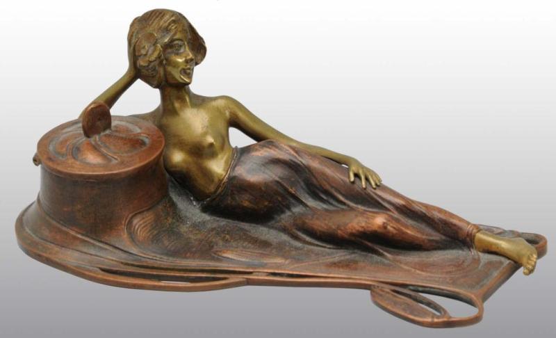 Appraisal: Bronze Inkwell with Art Nouveau Lady Reclining Description Marked Geschutz