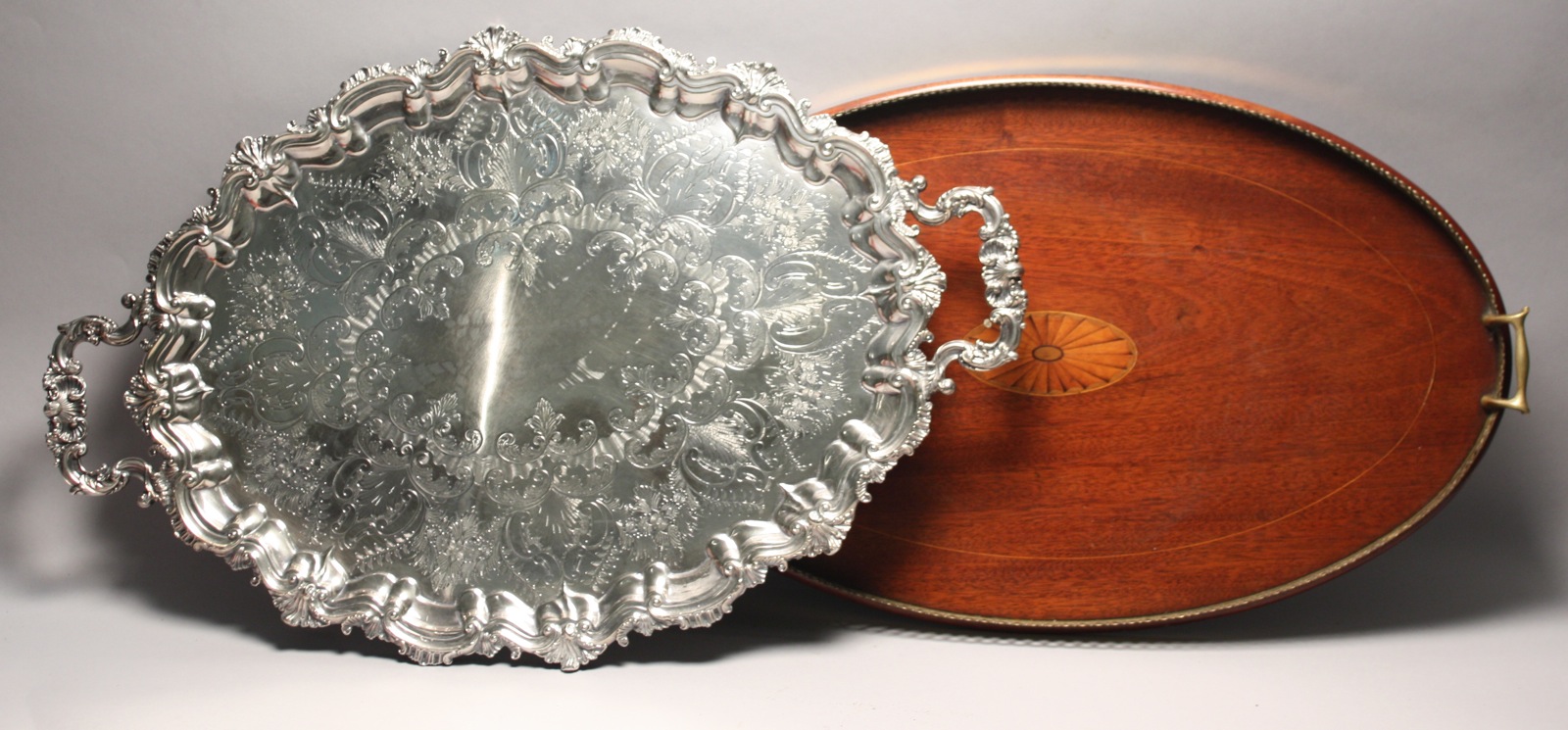 Appraisal: TWO-HANDLED SILVER PLATED WAITER With foliate and scroll edges handles