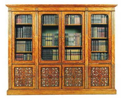 Appraisal: A William IV satinwood and marquetry bookcase inlaid with bird's