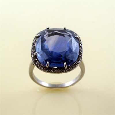 Appraisal: A sapphire and diamond cluster ring the large oval shaped