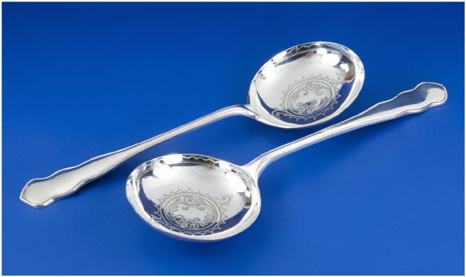 Appraisal: Pair of Silver Ladles Engraved bowls Hallmarked Sheffield Weight approximately