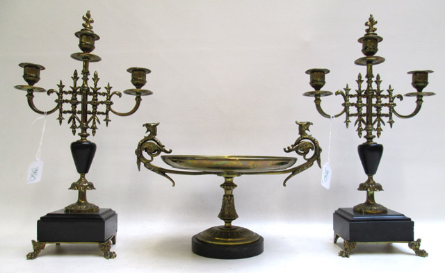 Appraisal: FRENCH STYLE BRASS TAZZA AND PAIR OF CANDELABRA the split