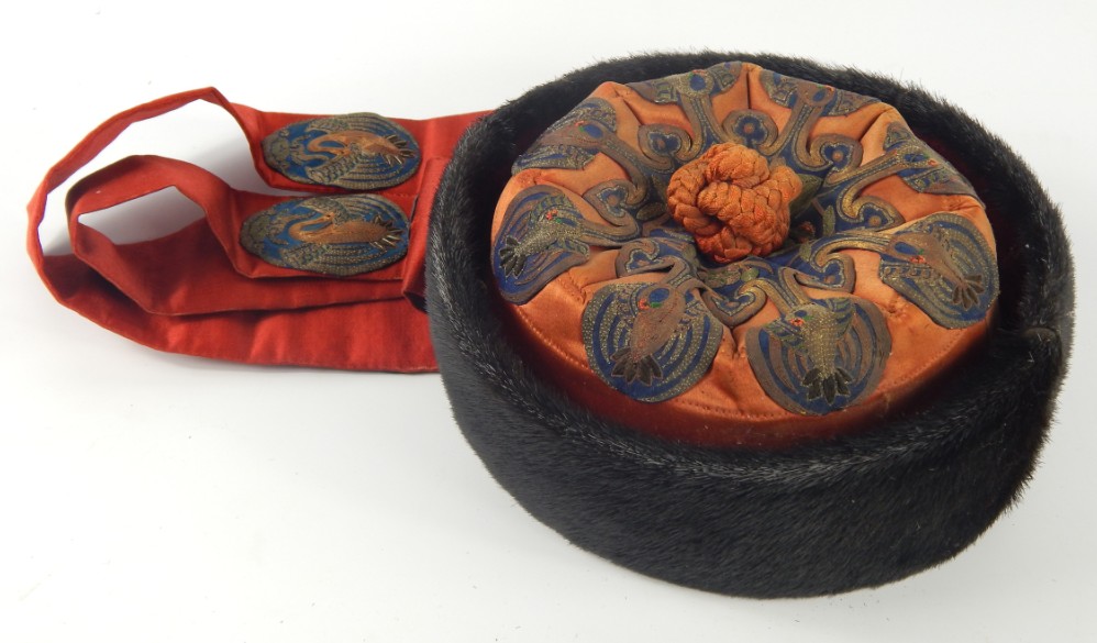 Appraisal: A Chinese circular hat with fur banding and needlework silk