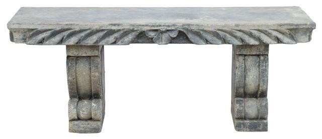 Appraisal: Cast stone garden bench with foliate motif apron rising on