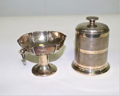 Appraisal: A silver cigarette dispenser JC Ltd Birmingham of cylinder form