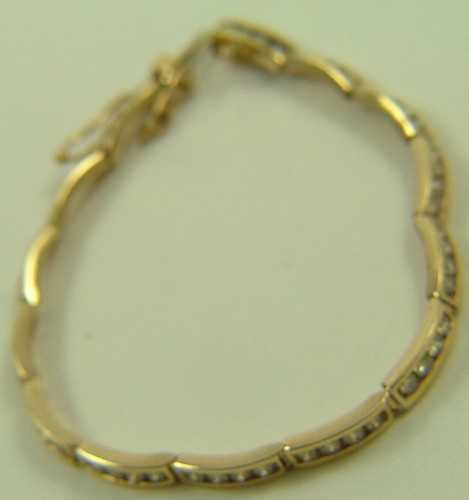 Appraisal: DIAMOND AND TEN KARAT GOLD BRACELET - in length and