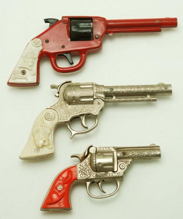 Appraisal: Lot of three cap guns One - cast iron Gene