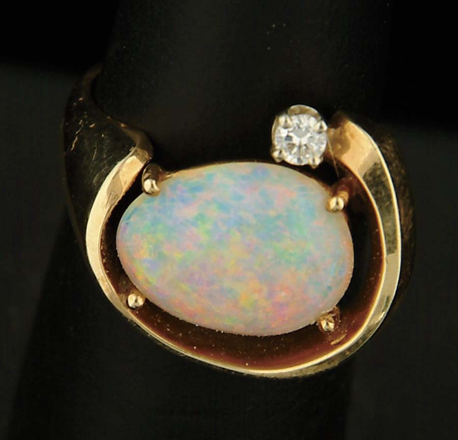 Appraisal: OPAL DIAMOND AND K YELLOW GOLD RING Free form design