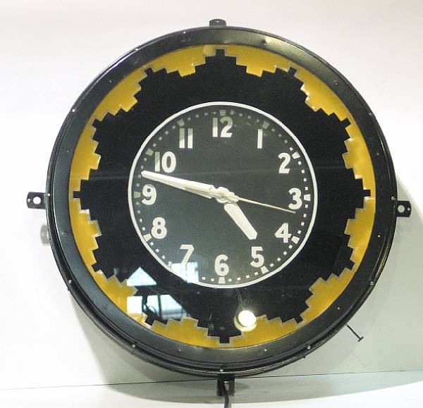 Appraisal: Oval Advertising illuminated Wall Clocks Two decorative Glass and Metal