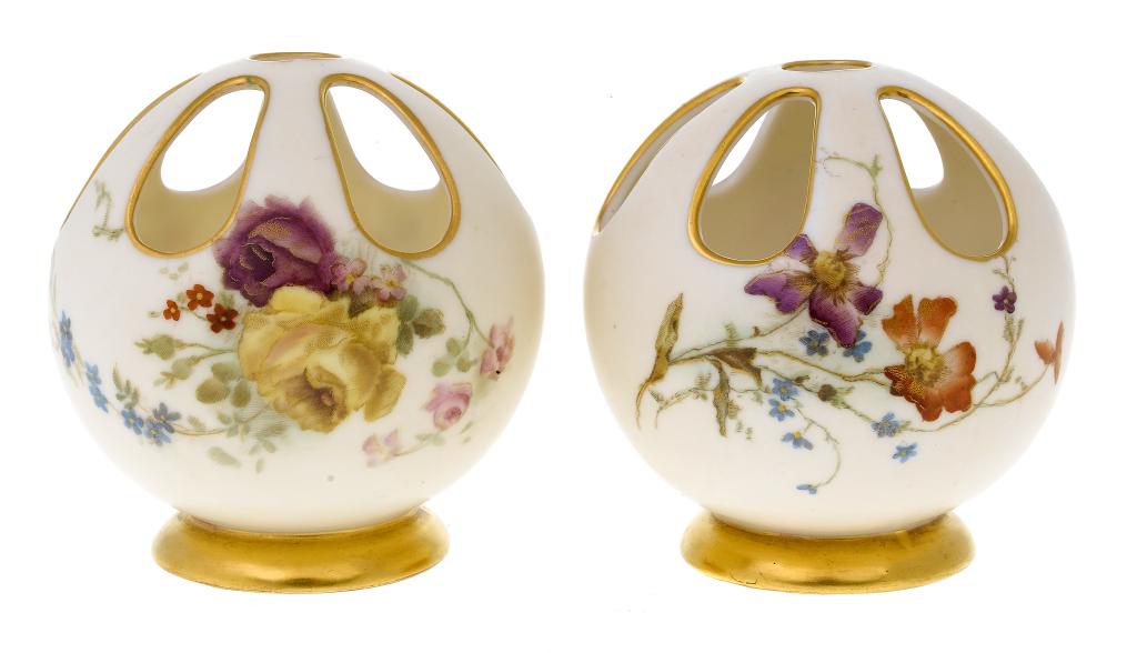 Appraisal: A PAIR OF ROYAL WORCESTER VIOLET VASES of fenestrated spherical