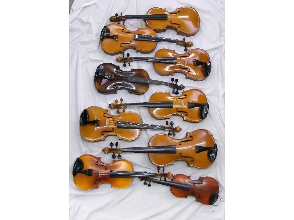 Appraisal: Eight various contemporary student violins together with a contemporary viola