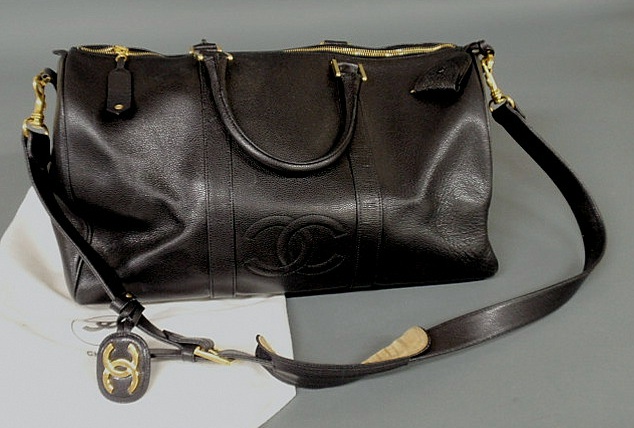 Appraisal: Chanel small black caviar duffle bag with detachable shoulder strap