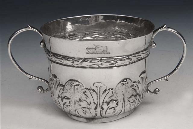 Appraisal: A JAMES II SILVER PORRINGER with chased leaf decoration and