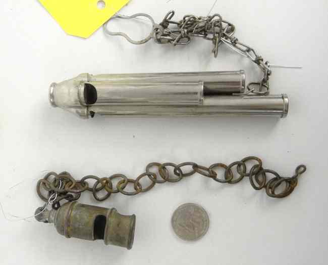 Appraisal: tone whistle made in England and standard whistle on chain