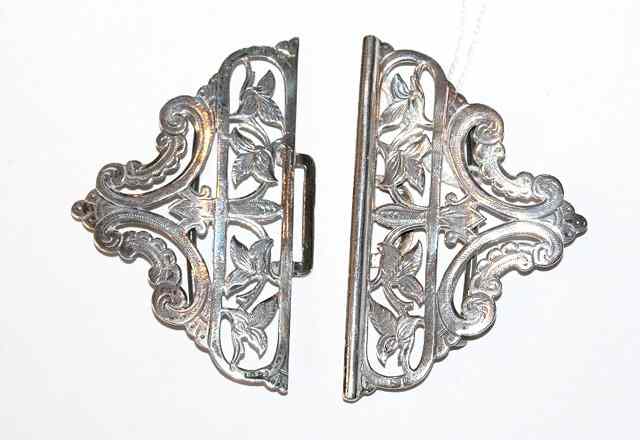 Appraisal: A LATE VICTORIAN SILVER BELT BUCKLE with pierced leaf and