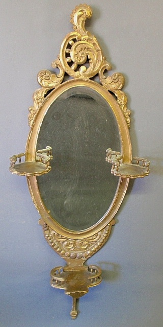 Appraisal: - Continental style oval gilt mirror with galleried side and