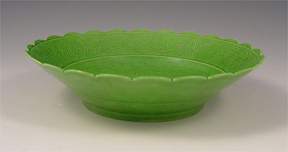 Appraisal: ANTIQUE GREEN GLAZED CHINESE BOWL Incised dragon design '' dia