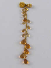 Appraisal: A yellow metal tests carat gold citrine pendant approx cm