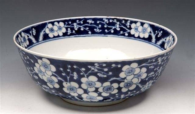 Appraisal: A CHINESE BLUE AND WHITE BOWL with prunus blossom branches