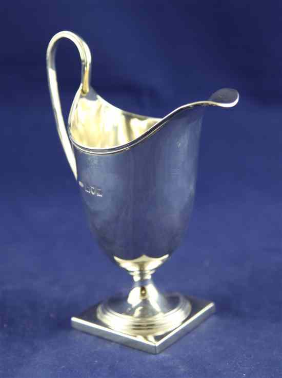 Appraisal: A George V silver helmet shaped cream jug by Asprey