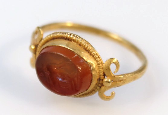 Appraisal: A Roman carnelian intaglio ring set with a figure with