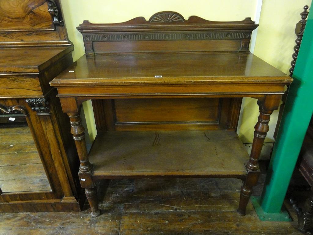 Appraisal: A late Victorian Edwardian walnut buffet serving table on two