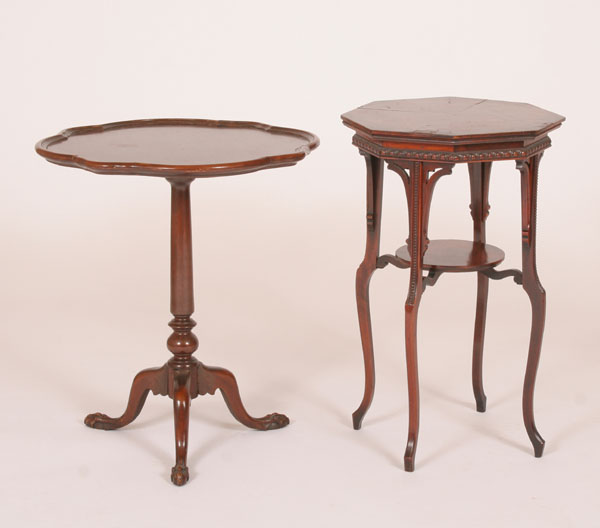 Appraisal: Two Art Deco mahogany stands pie crust and book matched