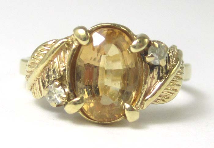 Appraisal: YELLOW TOPAZ DIAMOND AND YELLOW GOLD RING The k gold