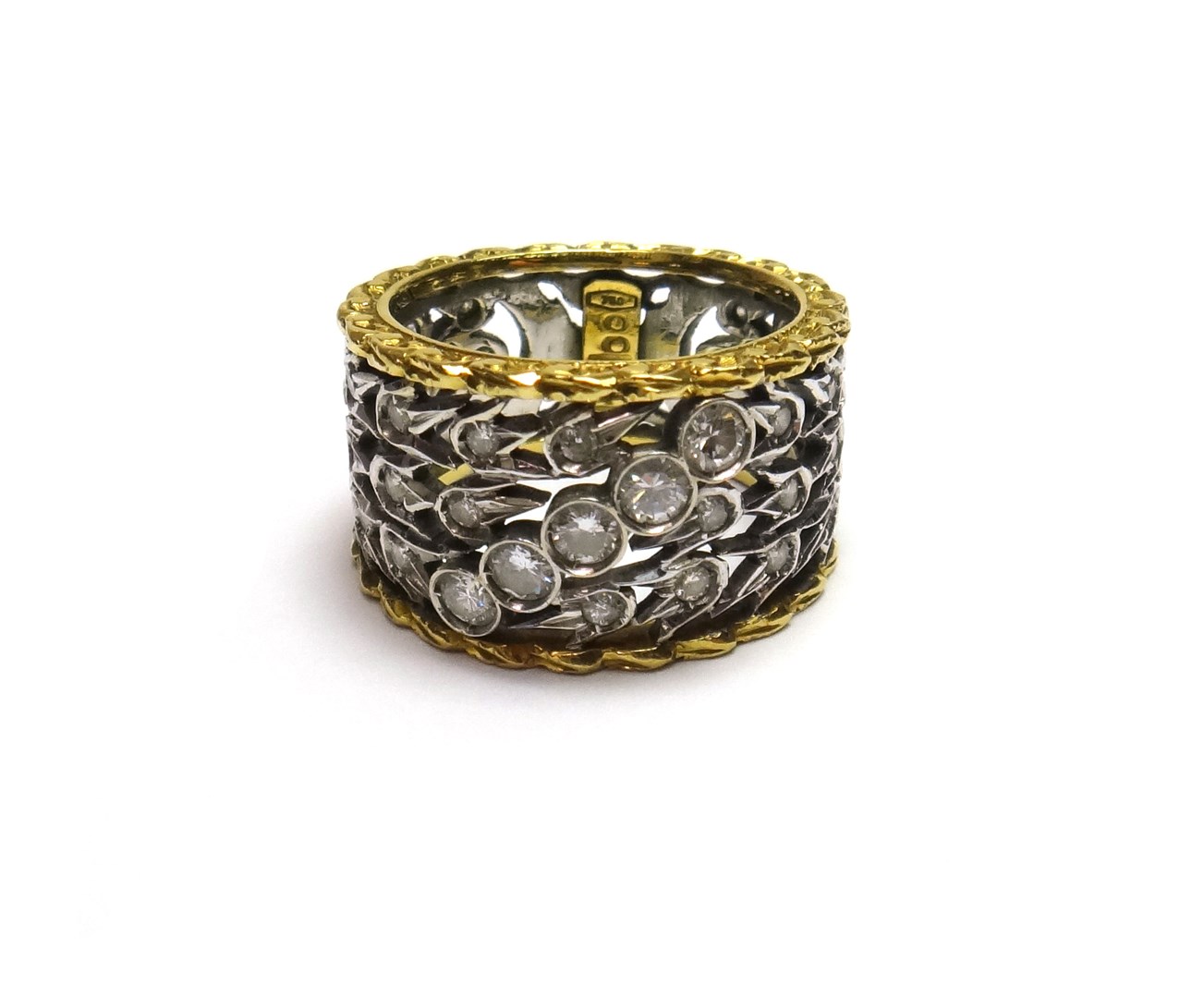 Appraisal: A yellow and white gold and diamond set band ring