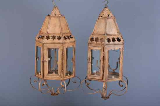 Appraisal: PAIR BROWN-PAINTED T LE HEXAGONAL-FORM HALL LANTERNS Arched crest glazed