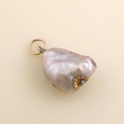 Appraisal: A large baroque pearl pendant Gold mounts cm high