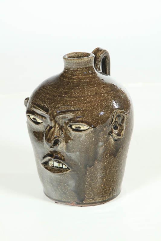 Appraisal: GROTESQUE JUG Georgia th century stoneware Signed David Meaders -