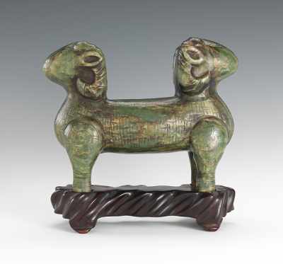 Appraisal: Double Headed Ram Spinach Jadeite Figurine With carved details on