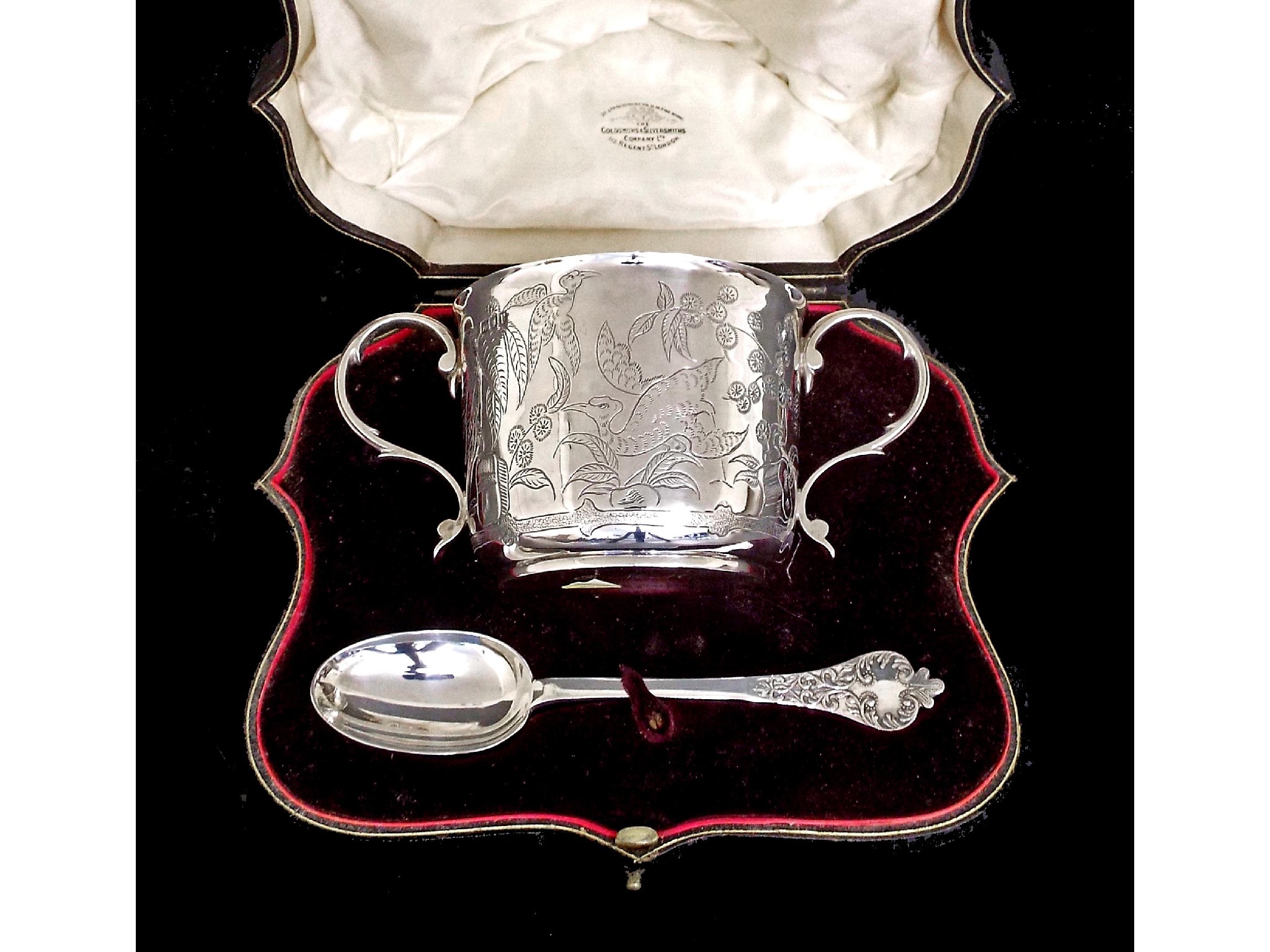 Appraisal: Attractive George V cased twin handled silver porringer and spoon