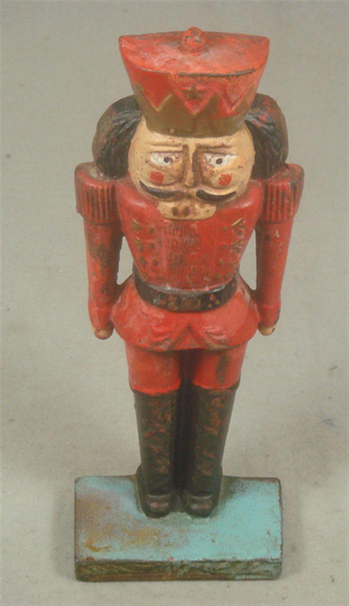 Appraisal: Cast iron doorstop colorful caricature Nutcracker soldier on blue base