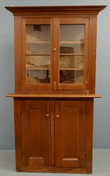 Appraisal: Pine two-piece corner cupboard h x w x d