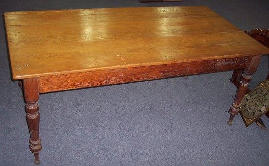 Appraisal: A Victorian pine kitchen table the triple plank top on