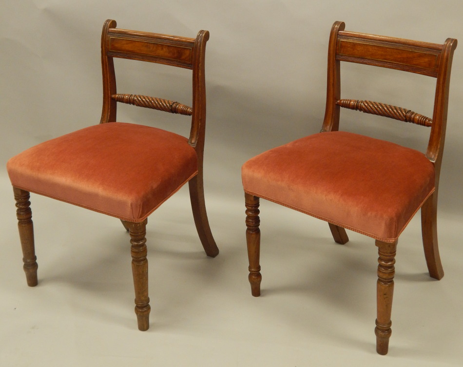 Appraisal: A pair of early thC mahogany bar back dining chairs