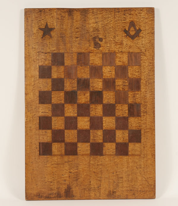 Appraisal: Folk art figured maple game board inlaid contrasting squares and